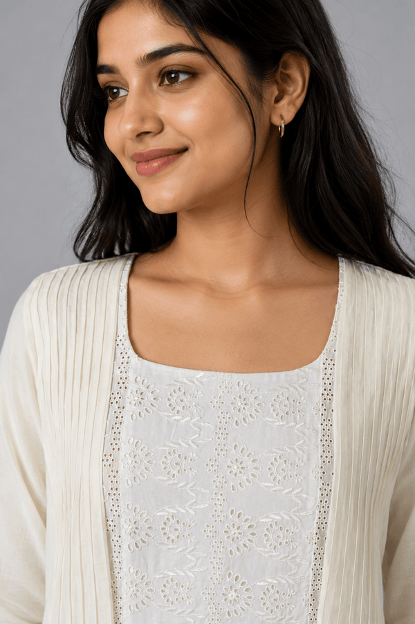Ivory Zoya White Glass Chanderi Dress with floral embroidery and pleated detailing for festive wear
