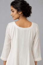 Ivory Zoya White Glass Chanderi Dress with floral embroidery and pleated detailing for festive wear back view