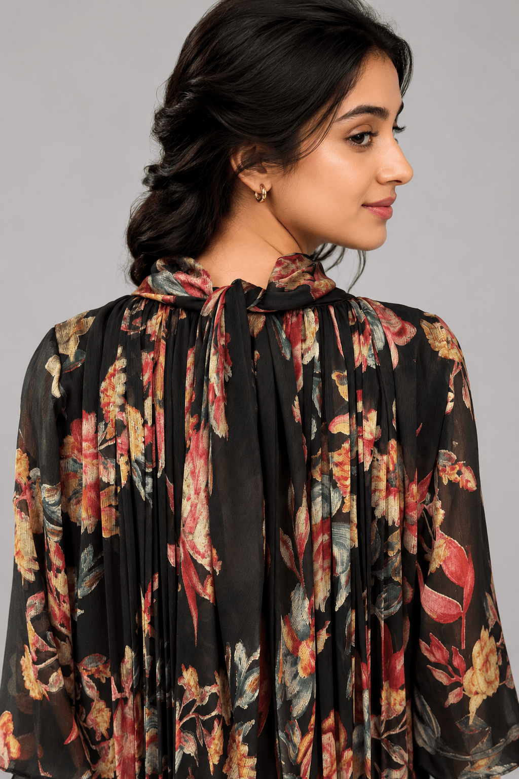 Gulnaar Black Floral Crushed Chiffon Dress with floral print and elegant pleated design for festive and party wear back view